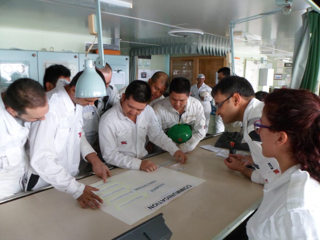 Crew and officers of Arctic Spirit discussing the ‘Three Blades of Leadership’