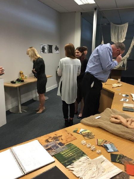 Aberdeen office staff taking a closer look at the art